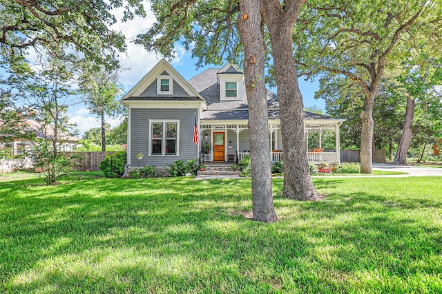 view of front of house with a front lawn and a porch