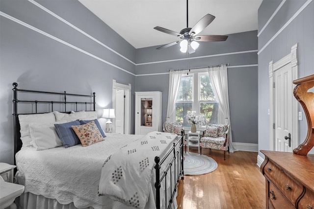 bedroom featuring ceiling fan and hardwood / wood-style floors