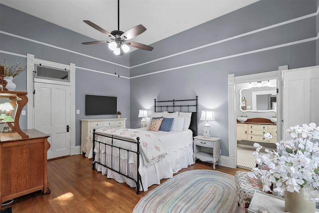 bedroom with ceiling fan and dark hardwood / wood-style floors