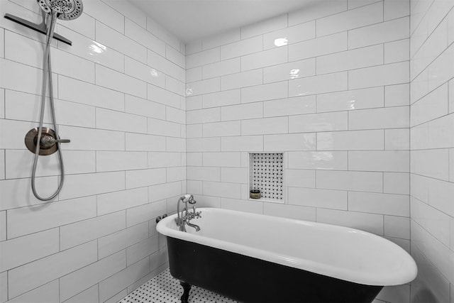 bathroom featuring tile walls and a bath