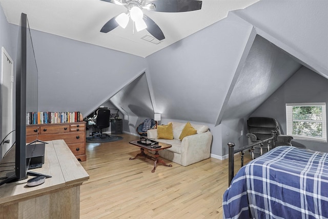 bedroom featuring ceiling fan, vaulted ceiling, and light hardwood / wood-style flooring