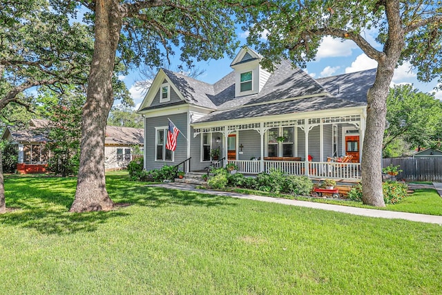 view of front of house featuring a front yard and a porch