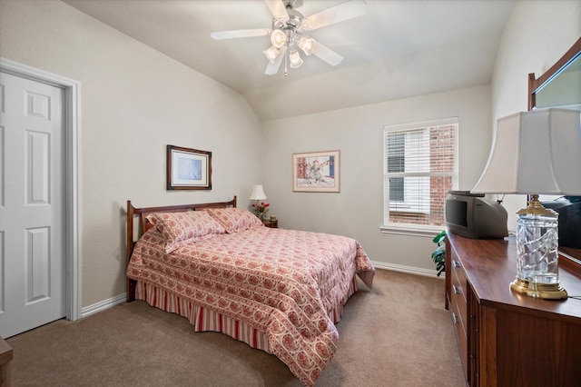 bedroom with ceiling fan, lofted ceiling, and light colored carpet