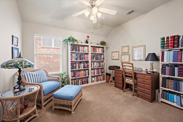 carpeted home office with vaulted ceiling and ceiling fan