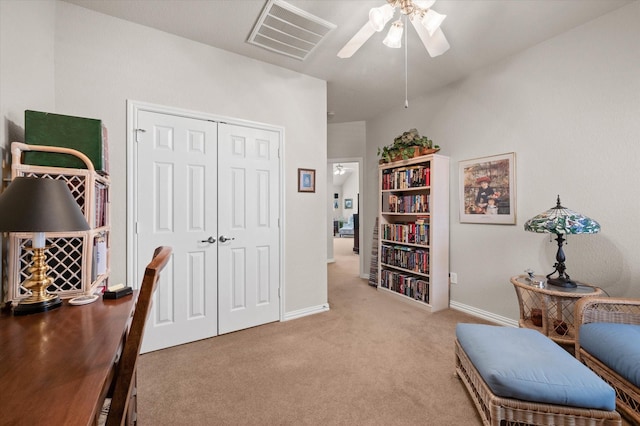 office area with ceiling fan and light colored carpet