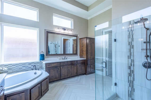 bathroom featuring vanity and shower with separate bathtub