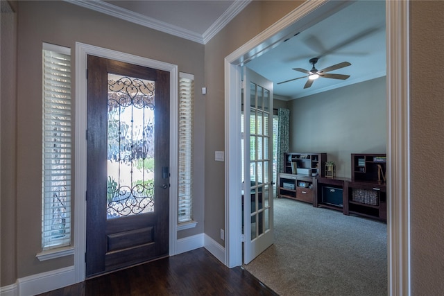 entryway with ceiling fan, dark hardwood / wood-style floors, and crown molding