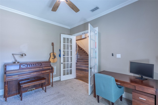 office area with ceiling fan, light carpet, crown molding, and french doors