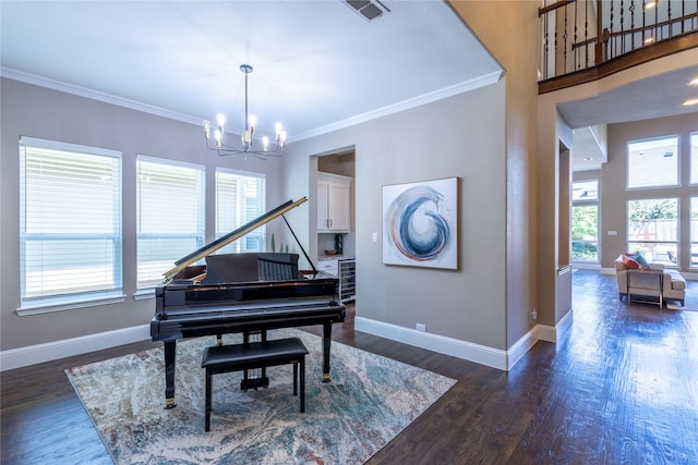 misc room featuring dark hardwood / wood-style floors, beverage cooler, an inviting chandelier, and ornamental molding