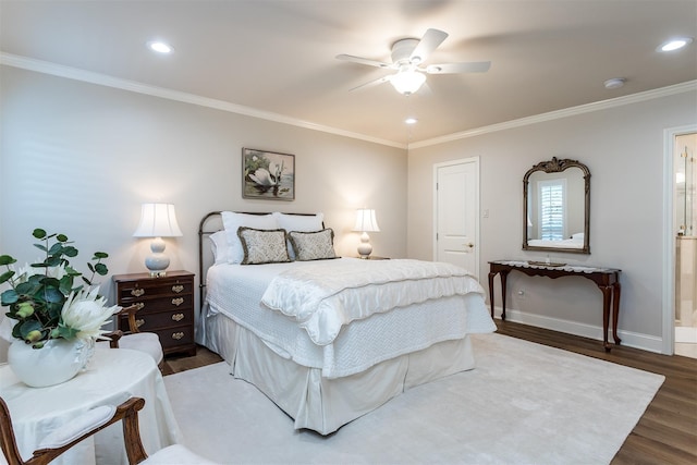 bedroom with dark wood-type flooring, ceiling fan, ornamental molding, and ensuite bathroom