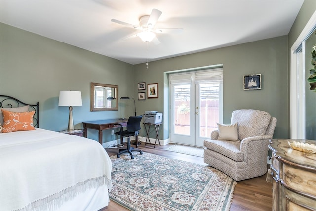 bedroom featuring ceiling fan, access to exterior, wood-type flooring, and french doors