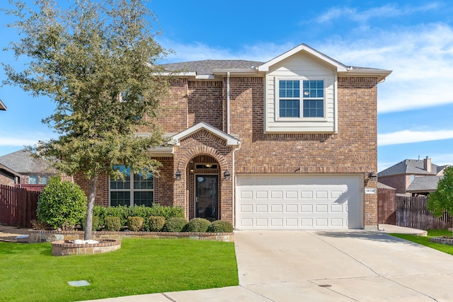 view of front of house featuring a front lawn and a garage