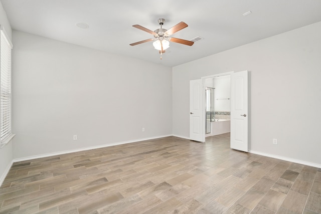 unfurnished room featuring ceiling fan and light hardwood / wood-style flooring