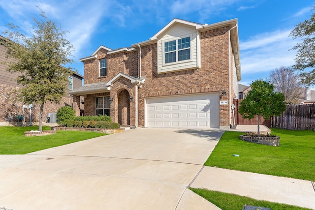 view of front of home featuring a garage and a front yard