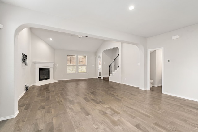 unfurnished living room with ceiling fan and light hardwood / wood-style floors