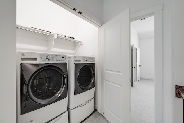 laundry area with separate washer and dryer