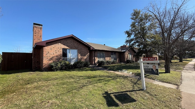 single story home with a front yard