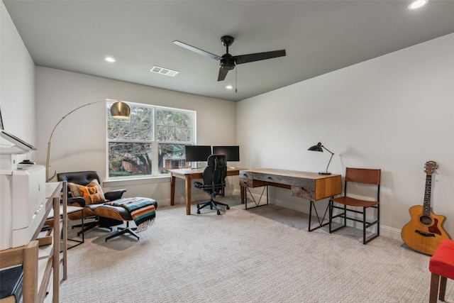 carpeted home office with ceiling fan