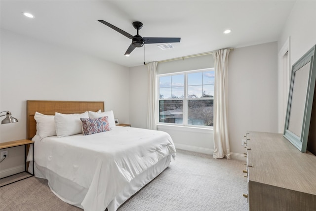 bedroom featuring ceiling fan and light colored carpet