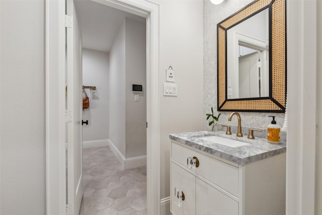 bathroom with tile patterned flooring and vanity