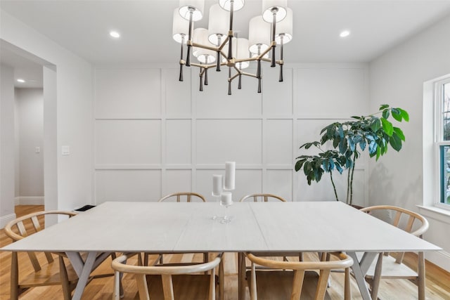 9736 Chiswell Rd, Dallas, TX 75238 - dining space featuring a chandelier, recessed lighting, light wood-style floors, and a decorative wall