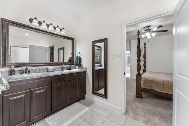 bathroom featuring ceiling fan, tile patterned floors, and vanity