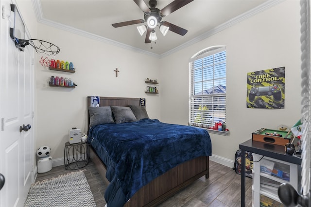 bedroom with ceiling fan, dark hardwood / wood-style floors, and crown molding