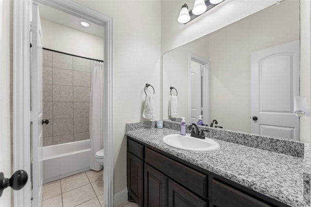 full bathroom with toilet, tile patterned floors, vanity, and shower / tub combo