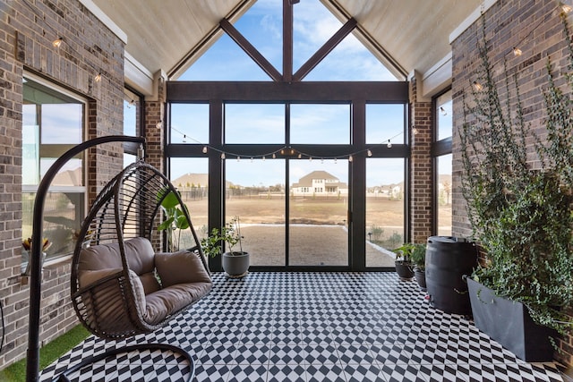 unfurnished sunroom with vaulted ceiling