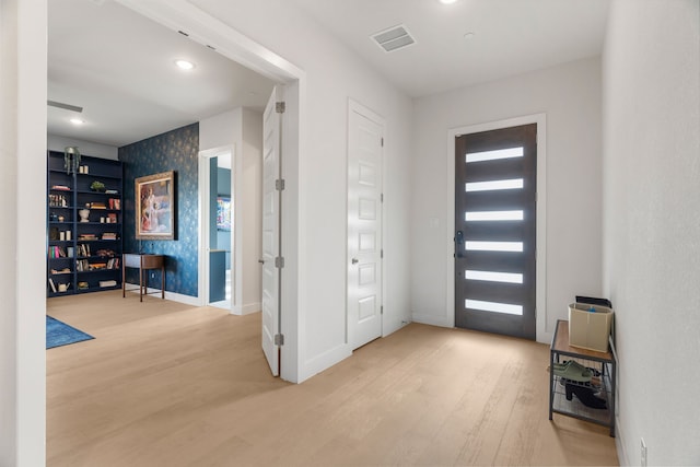 entryway with light hardwood / wood-style floors