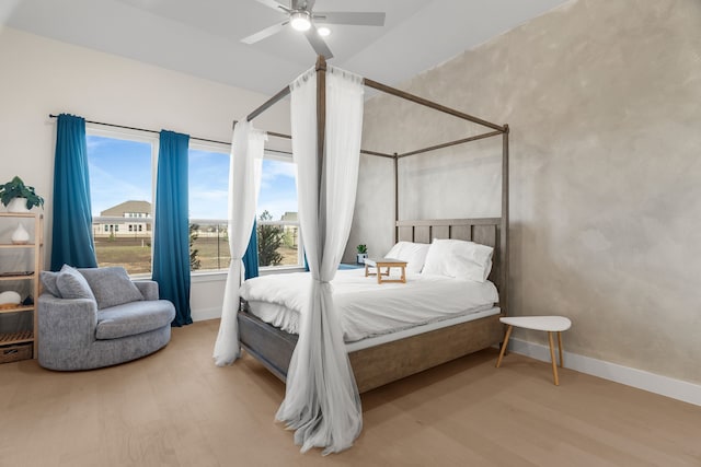 bedroom with ceiling fan and hardwood / wood-style flooring