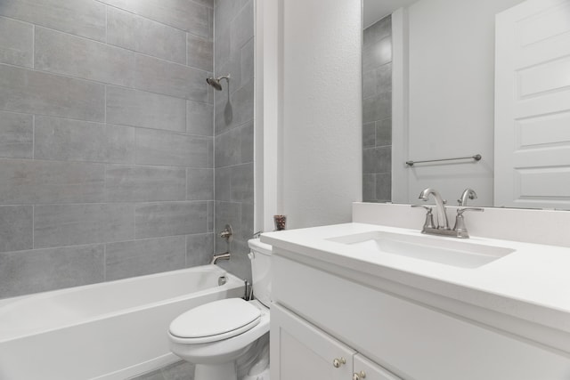 bathroom with toilet, tub / shower combination, and vanity