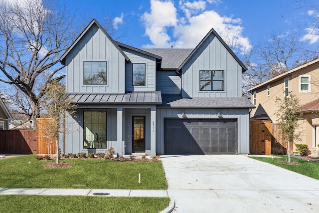 modern farmhouse style home with a garage and a front yard