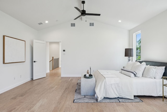 bedroom featuring lofted ceiling, light wood-type flooring, and ceiling fan