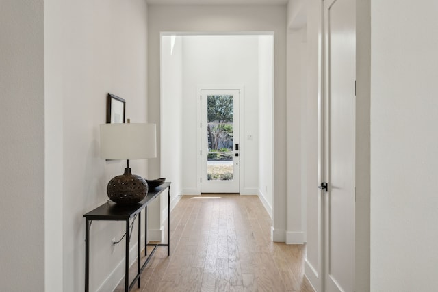 hall with light hardwood / wood-style floors