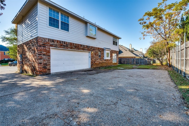 view of side of property featuring a garage