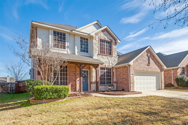 view of property with a front lawn and a garage