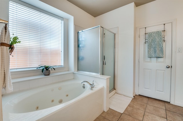 bathroom with independent shower and bath, tile patterned flooring, and plenty of natural light