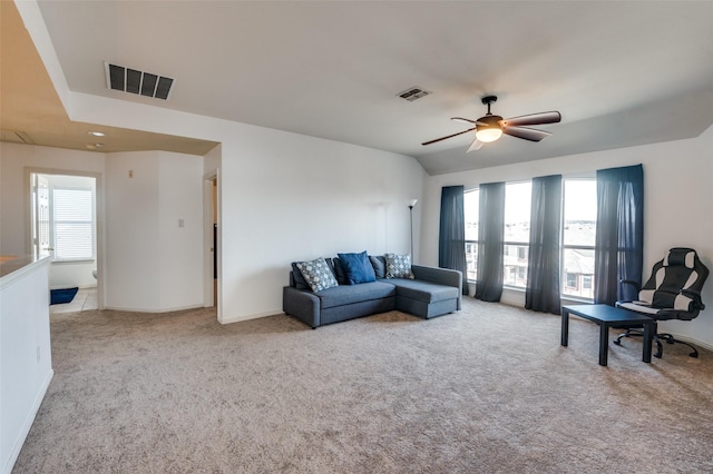 carpeted living room with ceiling fan