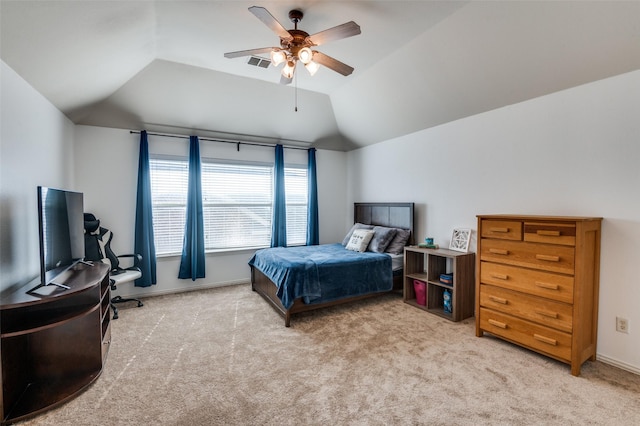 carpeted bedroom featuring vaulted ceiling and ceiling fan