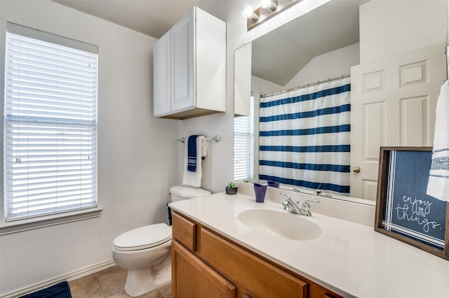 bathroom featuring toilet, tile patterned floors, and vanity