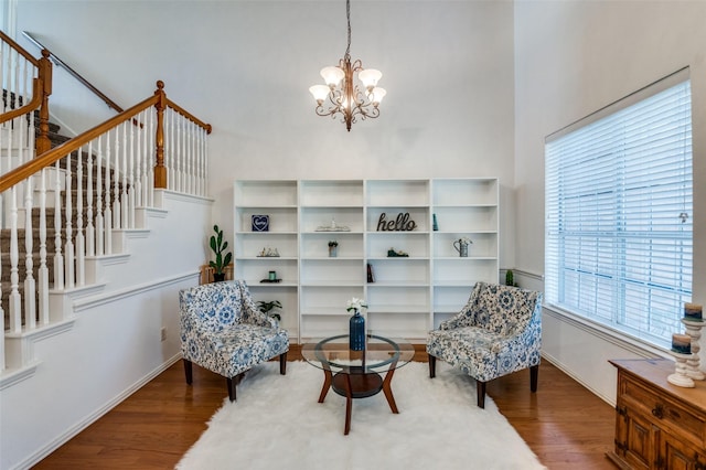 sitting room featuring hardwood / wood-style flooring and a notable chandelier