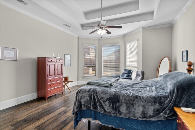 bedroom featuring dark wood-style flooring, a raised ceiling, visible vents, and baseboards