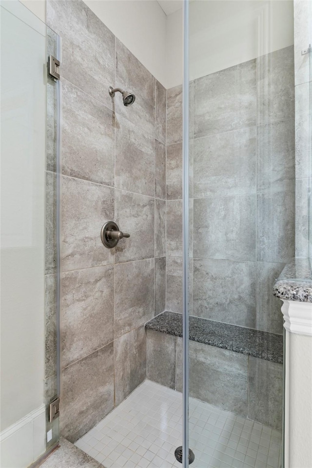 full bath featuring a shower stall