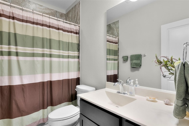 bathroom with vanity, toilet, and a shower with curtain