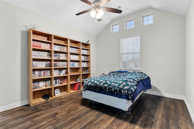 bedroom featuring lofted ceiling, visible vents, baseboards, and wood finished floors