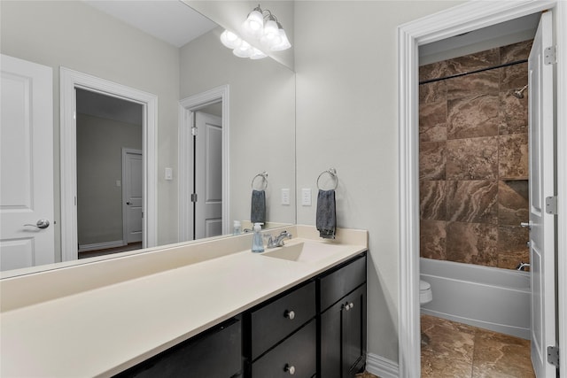 full bathroom featuring toilet, washtub / shower combination, and vanity