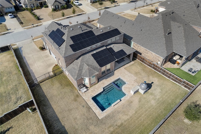 birds eye view of property with a residential view