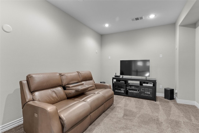 carpeted living area featuring baseboards, visible vents, and recessed lighting