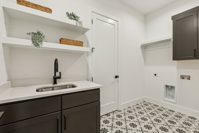 laundry area with washer hookup, sink, electric dryer hookup, and cabinets